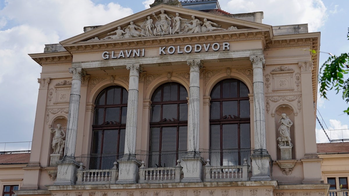 a building with statues on the front